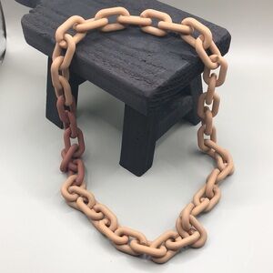 Chunky chain links infinity resin necklace, runway, catwalk look.